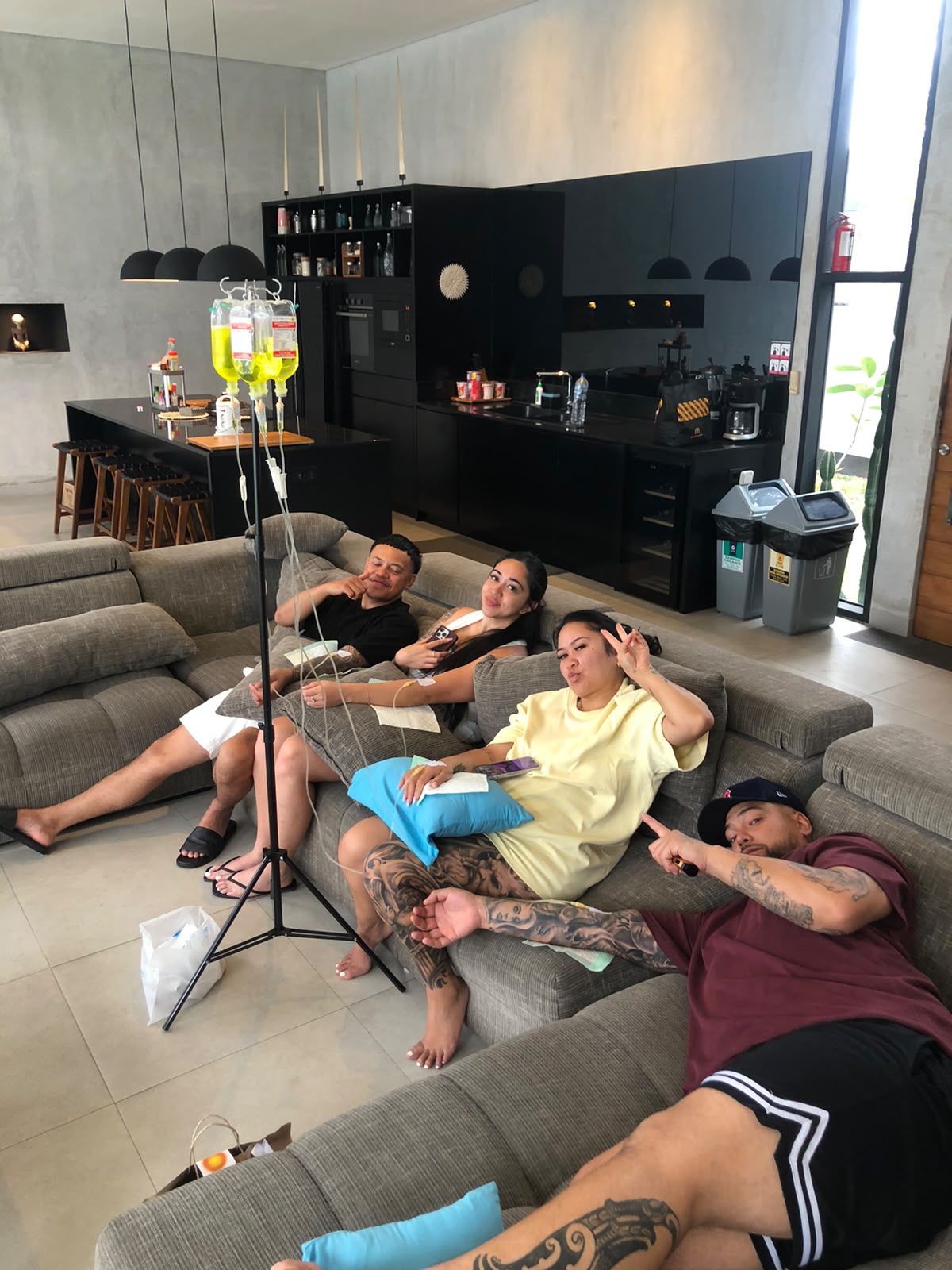Traveler recovering from a hangover in a Canggu villa with hydration support