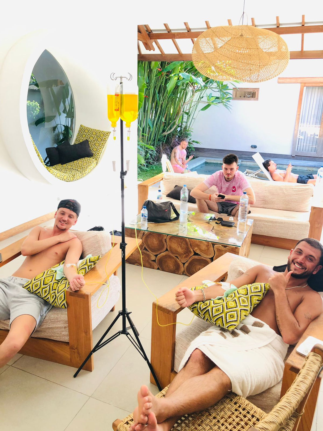 Client smiling during IV drip therapy at Bali villa